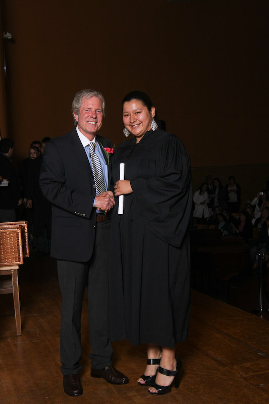 Receiving her diploma from John Crowe, retired Administrator of Adult Ed